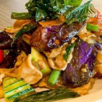 Eggplant Basil · Fried eggplant pieces, carrot, bell peppers, zucchini, sweet onion and basil stir fried with...