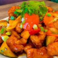 Sweet and Sour Chicken · Crispy chicken stir fried with fresh pineapple, yellow onion, bell pepper and tomatoes