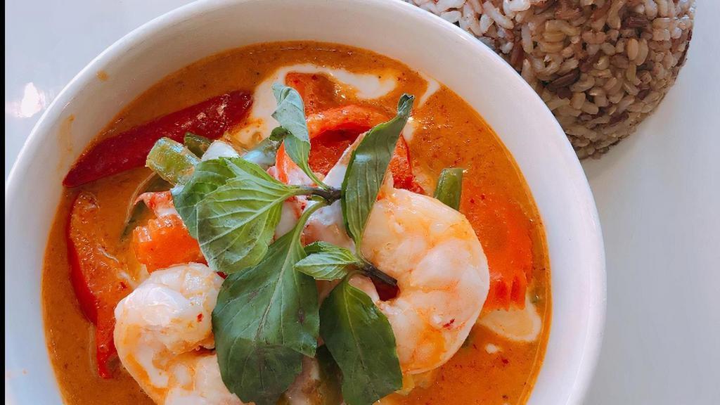 Red Curry · Choice of protein simmered in red curry sauce with bamboo shoots, green beans, bell peppers, basil and fried eggplants topped with coconut milk