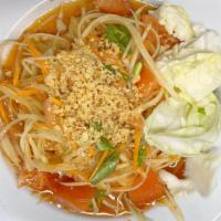 Papaya Salad · Green papaya mixed with lettuce, carrots, green beans in tangy salad dressing, topped with r...