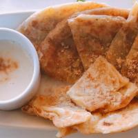 Sweet Roti · Pan fried flatbread topped with sweer condensed milk