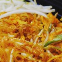Pad Thai  · Rice Noodle with egg, bean sprout, tofu, green onion with crushed peanut and lime on the side.