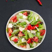 Best Italy Salad · Mixed greens, tomato, onion, cucumber, olives, and house vinaigrette.