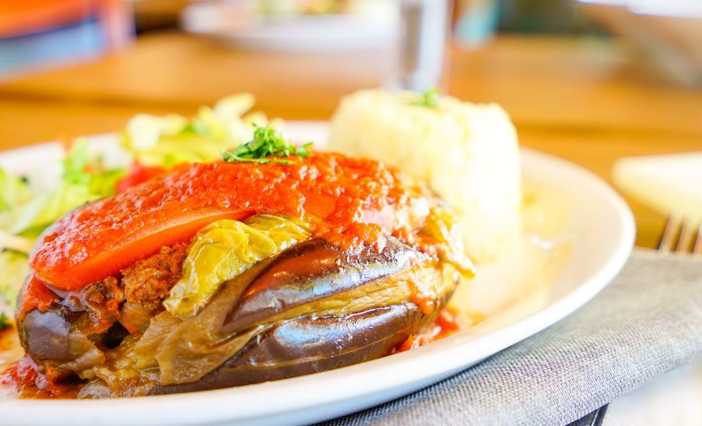 Stuffed Eggplant (Meat) · Baked eggplant stuffed with ground beef, tomato, onion, garlic & bell peppers, with tomato sauce, GF