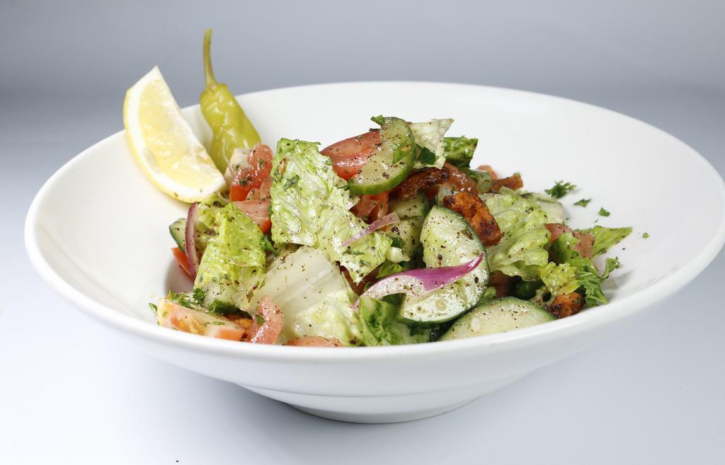 Fattoush Salad · Vegetarian. Romaine hearts, cucumber, tomato, onion, bell peppers, dried mint, sumac, pita chips & house dressing