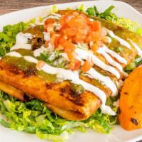 Chimichanga · Crispy fried burrito wrapped with choice of meat, Mexican rice, pinto beans and melted chees...