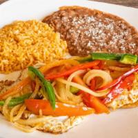 Huevos Rancheros · Crispy corn tortillas topped with over medium eggs with grilled bell peppers, onion, tomato.