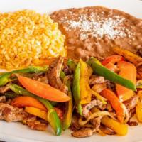 Fajitas · Marinated strips of chicken breast or steak with a complement of sautéed onions, tomatoes an...