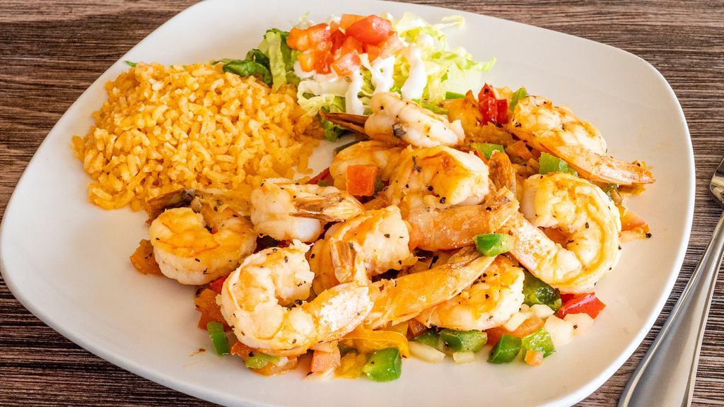 Camarones Rancheros · Grilled shrimp sautéed with bell peppers, onion, tomato and serrano peppers.