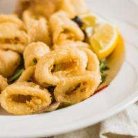 Calamari · Fresh fried squid served with cocktail sauce.