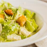 Caesar Salad · Chopped romaine lettuce topped with Parmesan cheese and croutons tossed with our homemade sp...