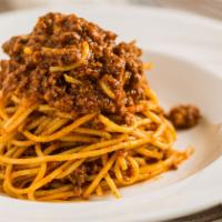 Spaghetti Bolognese · Spaghetti pasta topped with our delicious homemade meat sauce.