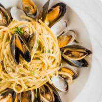 Linguine Vongole · Linguine pasta with clams in a garlic white wine sauce or marinara sauce.