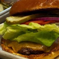 100% Angus Burger · Lettuce, tomato, red onion, pickles and garlic aioli on a potato bun.