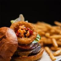 Market Deluxe Burger · Bacon and red pepper jam, fried onion ring, lettuce, tomato, red onion, pickles and garlic a...