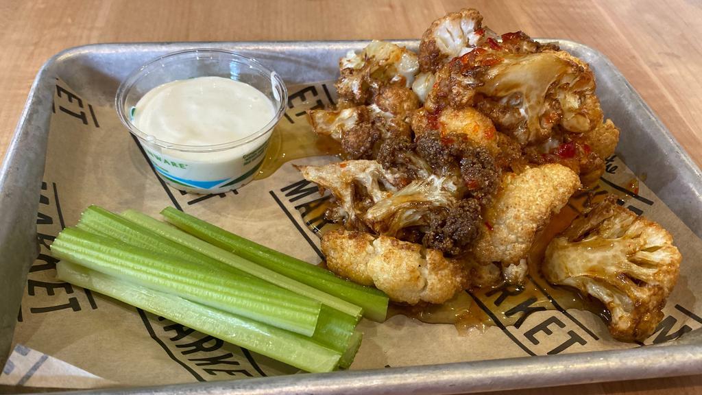 Crispy Cauliflower Bites · Fried and tossed in with your choice of sauce with celery and blue cheese dressing.