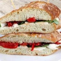Vegetarian Caprese Sandwich · Mozzarella cheese, basil, oven roasted tomatoes, olive oil, salt, and pepper on a francese r...