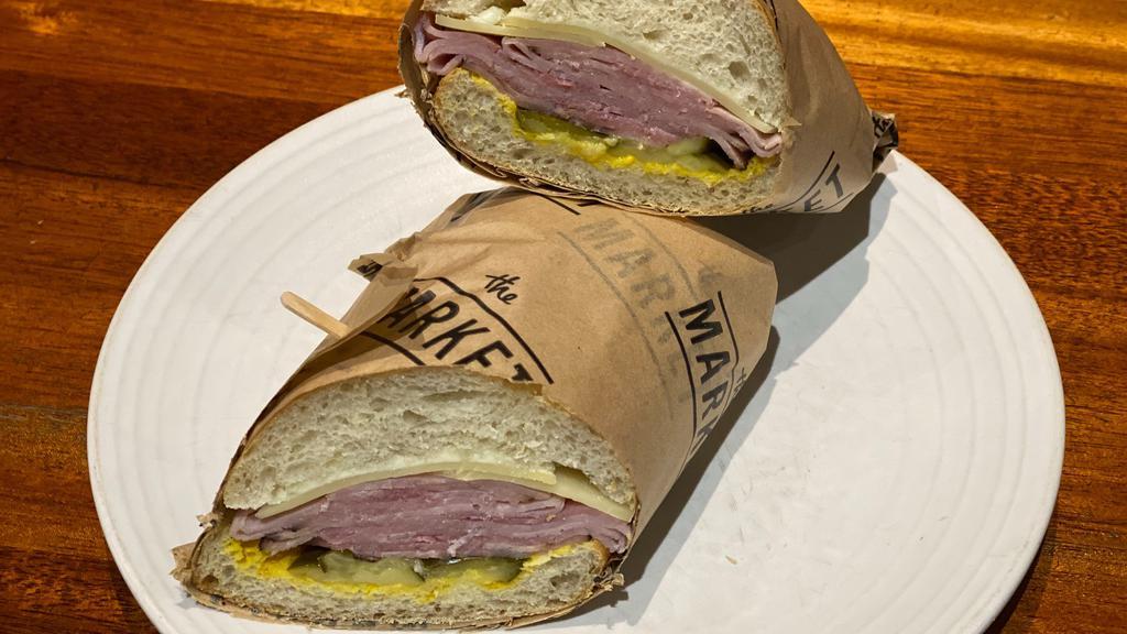 Ham & Gruyere Cheese Sandwich · Black forest ham, Gruyere, sliced dill pickle, Dijon mustard and butter on a francese roll.
