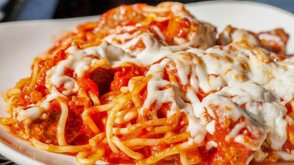 Spaghetti with Meatballs · Served with garlic bread.