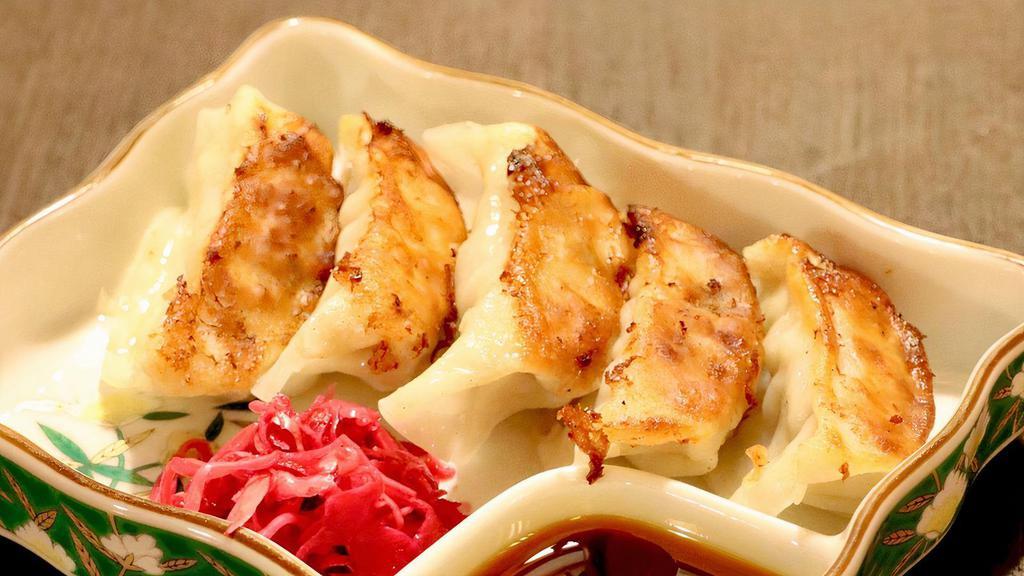 Gyoza (5) · Pork filled potstickers, pan fried, served with dipping sauce.