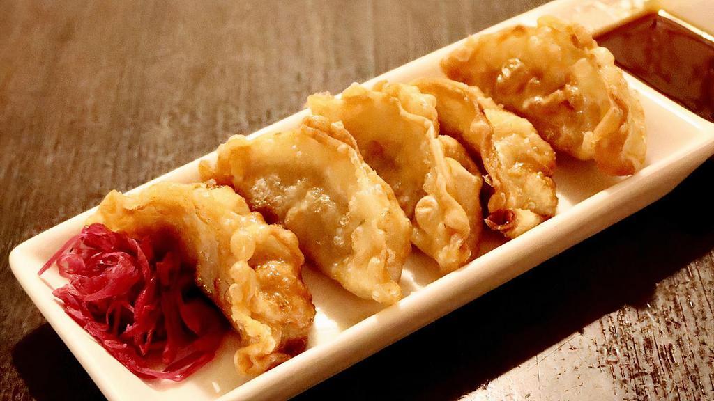 Gyoza Fry · Fried pork filled potstickers served with dipping sauce. (5pc).