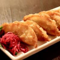 Vegetable Gyoza Fry (5) · Fried vegetable filled Japanese style potstickers served with dipping sauce. Vegetarian.