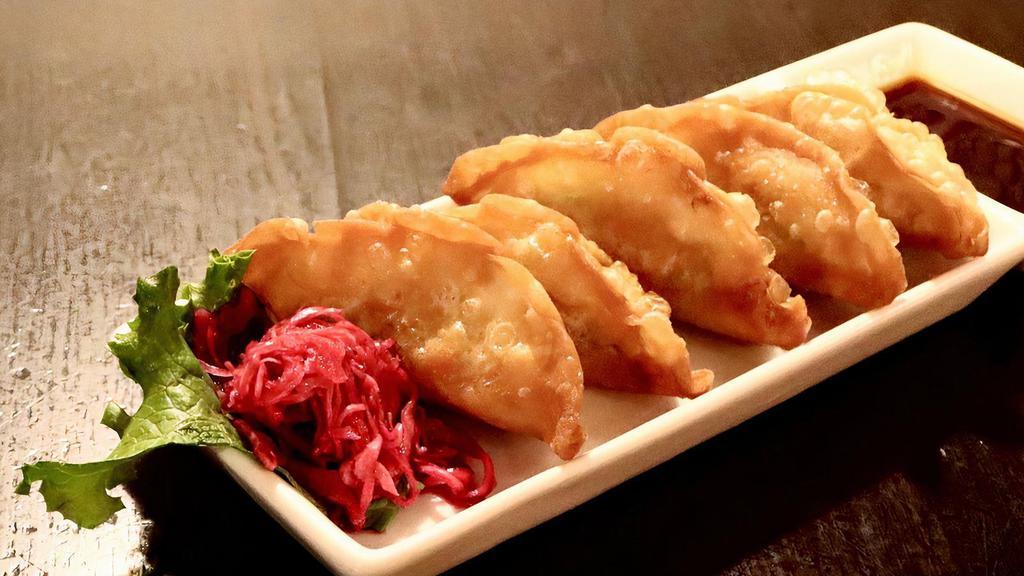 Vegetable Gyoza Fry (5) · Fried vegetable filled Japanese style potstickers served with dipping sauce. Vegetarian.
