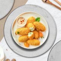 Hot Peno Poppers · Fresh jalapenos coated in cream cheese and fried until golden brown.