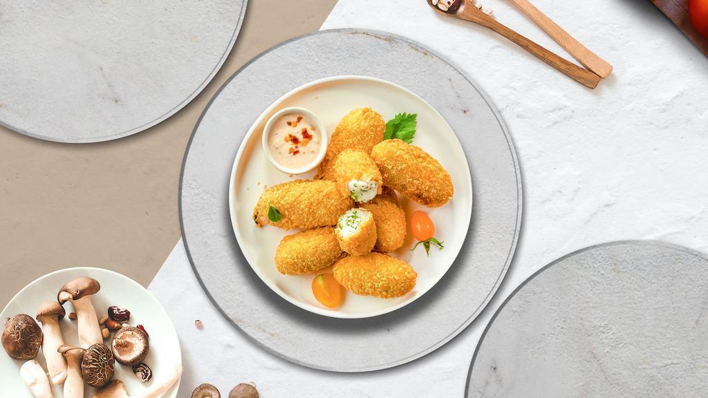 Hot Peno Poppers · Fresh jalapenos coated in cream cheese and fried until golden brown.