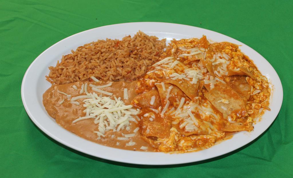 Chilaquiles · Refried beans, rice, tortilla chips sauteed with in a special sauce, eggs, cheese and sour cream.