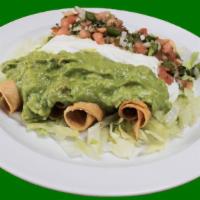 Chicken Flautas (Rolled Taquitos) · 4 chicken rolled taquitos topped with sour cream, guacamole and pico de gallo salsa