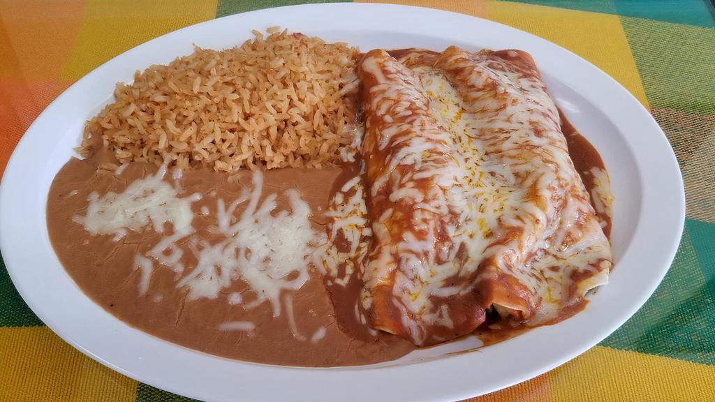 Enchilada Marinas Plate · Rice, Refried Beans, 2 enchiladas stuffed with shimp, pico de gallo topped with red salsa and cheese