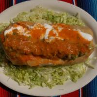 Chimichanga · Deep fried burrito. Choice of meat with rice and beans topped with guacamole and sour cream.