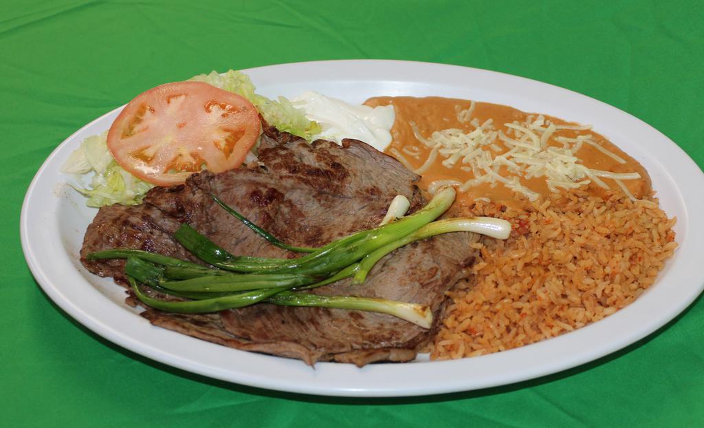 Mexican carne Asada Plate · Beef slices   served with rice, refried beans, grilled onions, lettuce, sour cream, guacamole and corn or flour tortillas.
