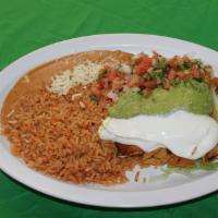 Flautas Dinner · 4 fried rolled corn tortillas with chicken, re-fried beans, rice, topped with guacamole, sou...