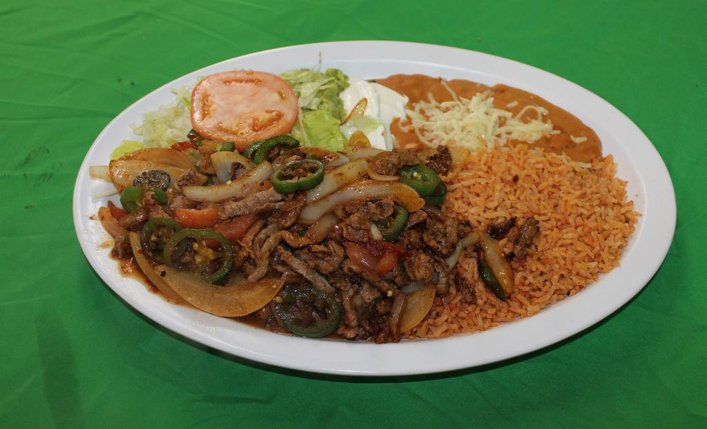 Bistec Ranchero · Grilled steal sauteed with jalapeno peppers, onions, tomato and tomatillo sauce. Served with rice, re-fried beans, lettuce, sour cream, guacamole and corn or flour tortillas.