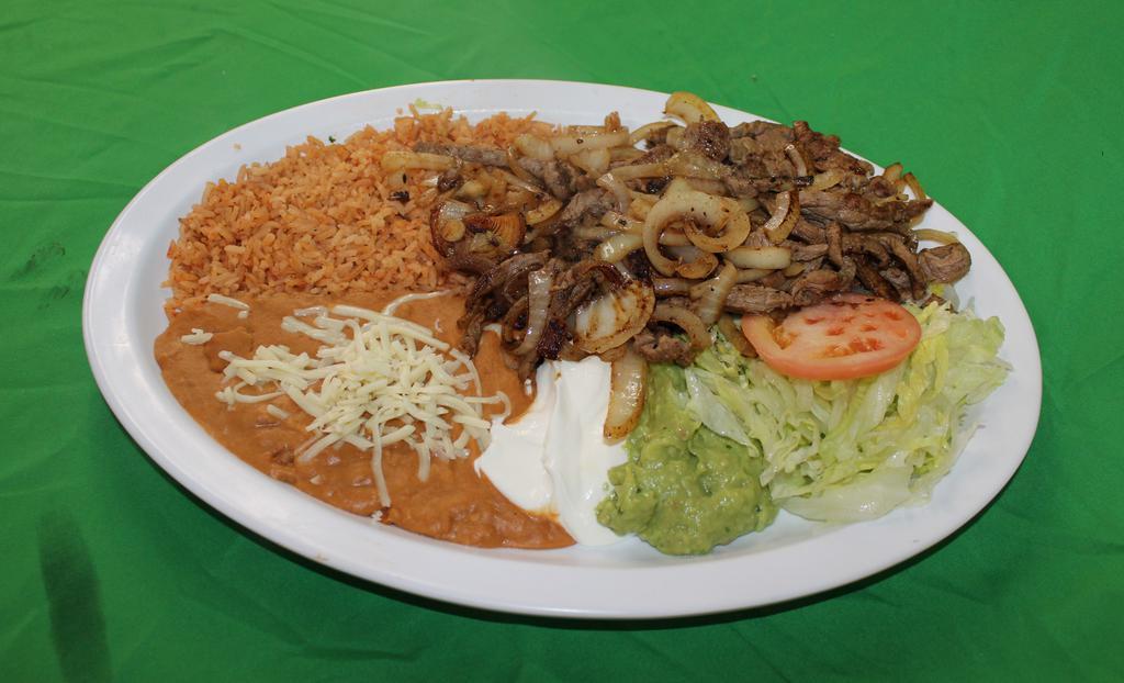 Bistec Encebollado · Beef sautéed in onions and seasonings. Served with rice, refried beans, cheese, lettuce, guacamole sour cream and tortillas.