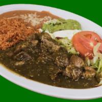 Chile Verde Plate · Pork in chile verde sauce served with rice, refried beans, lettuce, guacamole, sour cream an...