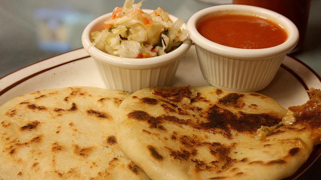 One Pupusa · Cheese filled masa stuffed with meat and/or beans that are grilled and typically served with a vinegary slaw called curtido.