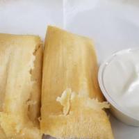 Salvadorian Corn Tamales (Tamales de Elote) · Salvadorian corn tamales with sour cream