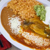 Two Items Combo (Tamales & Chile Relleno) · Includes rice, refried beans, lettuce, guacamole, sour cream and cheese.