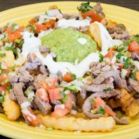 Carne Asada Fries · French fries topped with grilled steak, refried beans, chesse, guacamole, sour cream and pic...