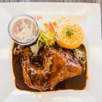 Chicken Mole · A blend of different chilies and nuts in a chocolate sauce over a chicken portion. Serve wit...
