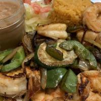 Fajitas · chicken,beef or prawns grilled  with onions, bell peppers and tomatoe Served with rice and b...