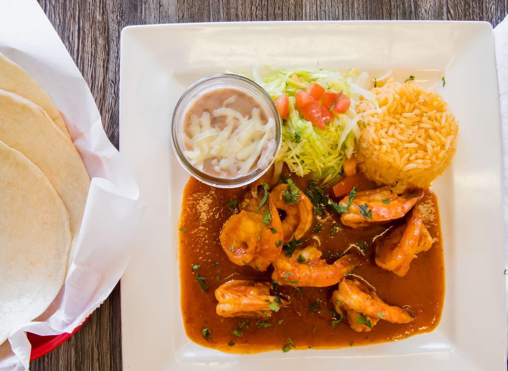 Camarones a La Diabla · Shrimp sautéed with chili the arbol sauce, serve with rice and beans and your choice of tortilla.