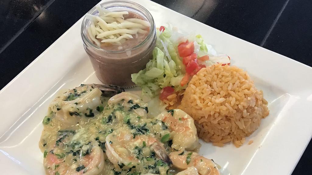 Shrimp Cilantro · Prawn sautéed with garlic, butter, cilantro and a hint of jalapeno, serve with a side of rice and beans and your choice of tortillas.