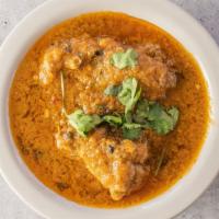 Chicken Curry · Chicken Cooked In A Traditional Blend Of Curry Spices.