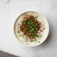 New England Clam Chowder · Very Creamy with red potatoes, celery, chives, clams, bacon with saltines.