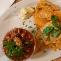 Shrimp Ceviche · Marinated shrimp, tomato, lime, cucumber, served with seasoned tortilla chips