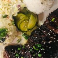 Guava Skirt Steak Plate · Skirt Steak marinated in Guava puree, gluten free soy sauce, ginger. Served with white rice,...
